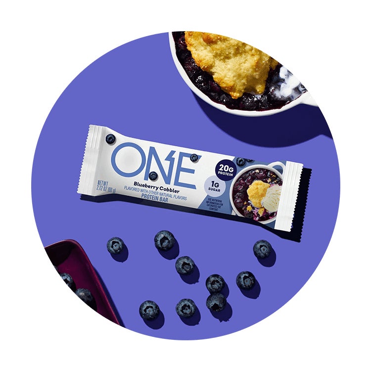 one bars blueberry cobbler flavored protein bar surrounded by flavor cues