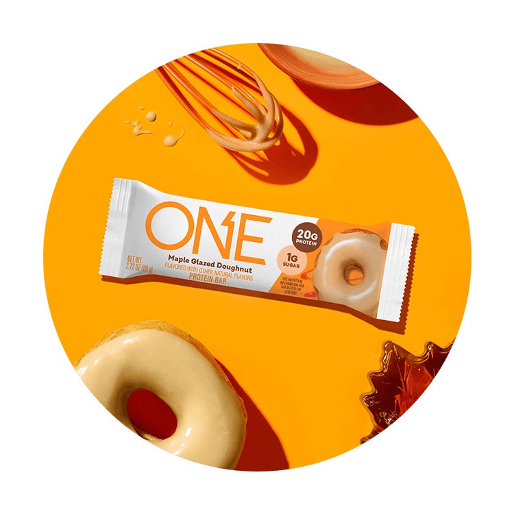 one bars maple glazed doughnut flavored protein bar surrounded by flavor cues