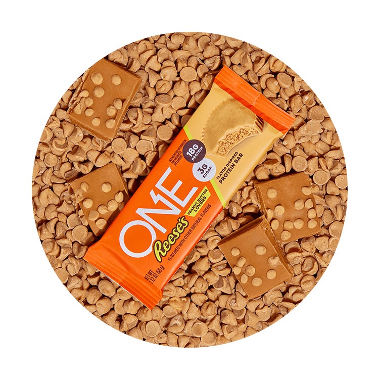 one reeses peanut butter lovers flavored protein bar surrounded by flavor cues